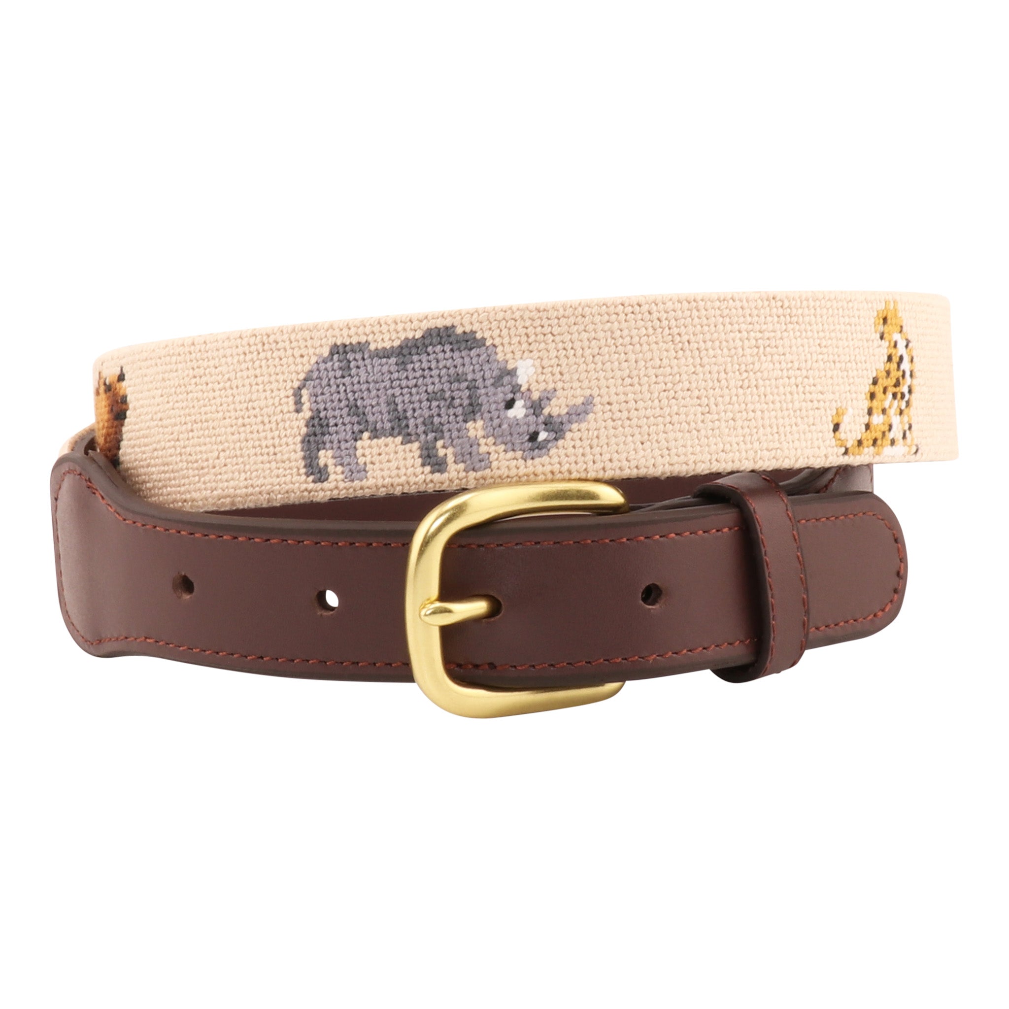 Safari animal needlepoint belt rolled to display lion, rhino, and cheetah designs with brown leather and brass buckle