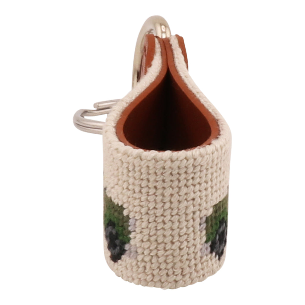 Hand-stitched Safari Needlepoint Key Fob with green safari vehicle design, full-grain leather backing, and stainless steel key ring by Huck Venture.