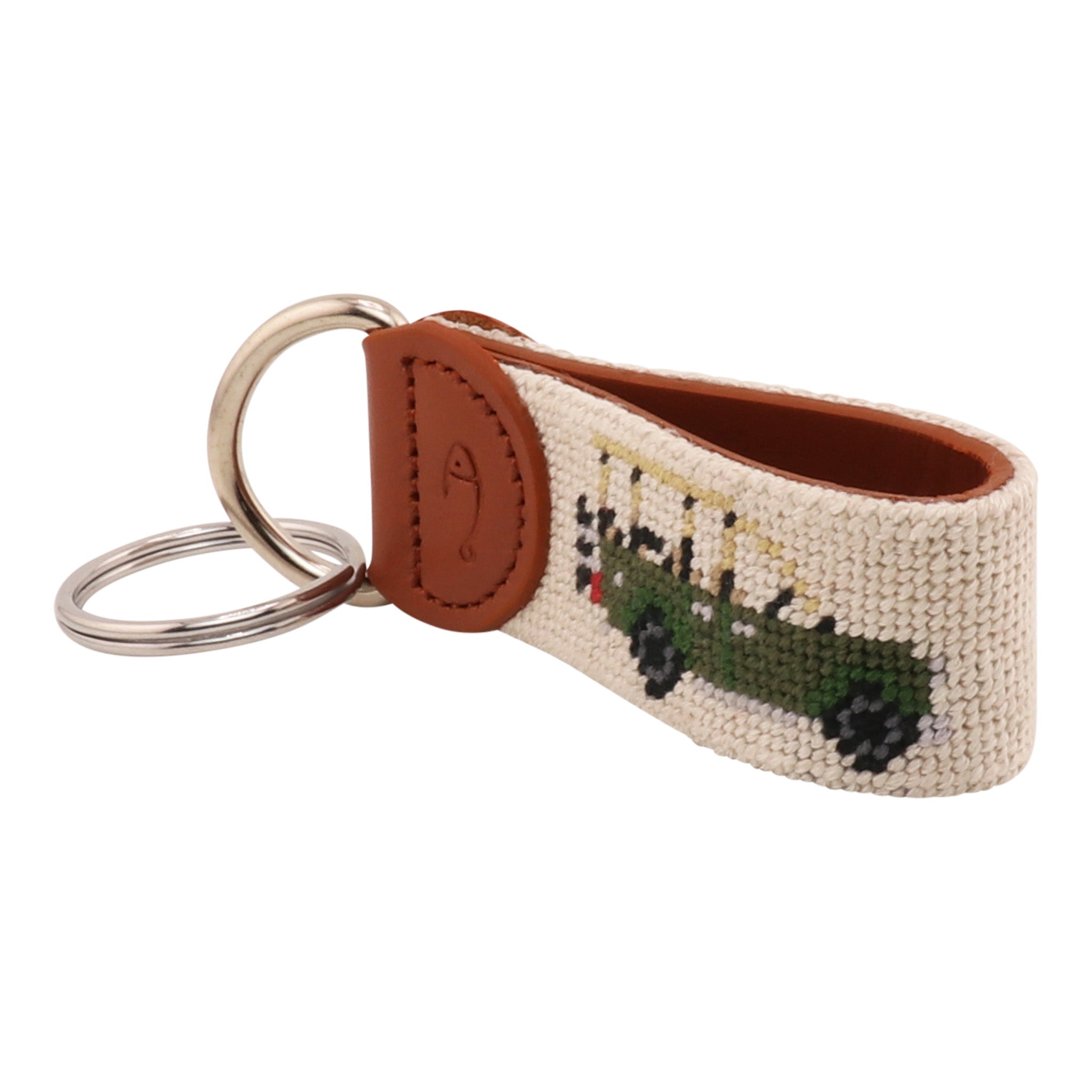 Hand-stitched Safari Needlepoint Key Fob with green safari vehicle design, full-grain leather backing, and stainless steel key ring by Huck Venture.