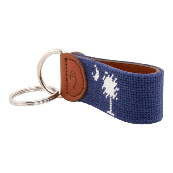 needlepoint keychain showing South Carolina State Flag against navy blue background, Palmetto and crescent, same design on both sides hand-stitched, leather backing with stainless steel keyring