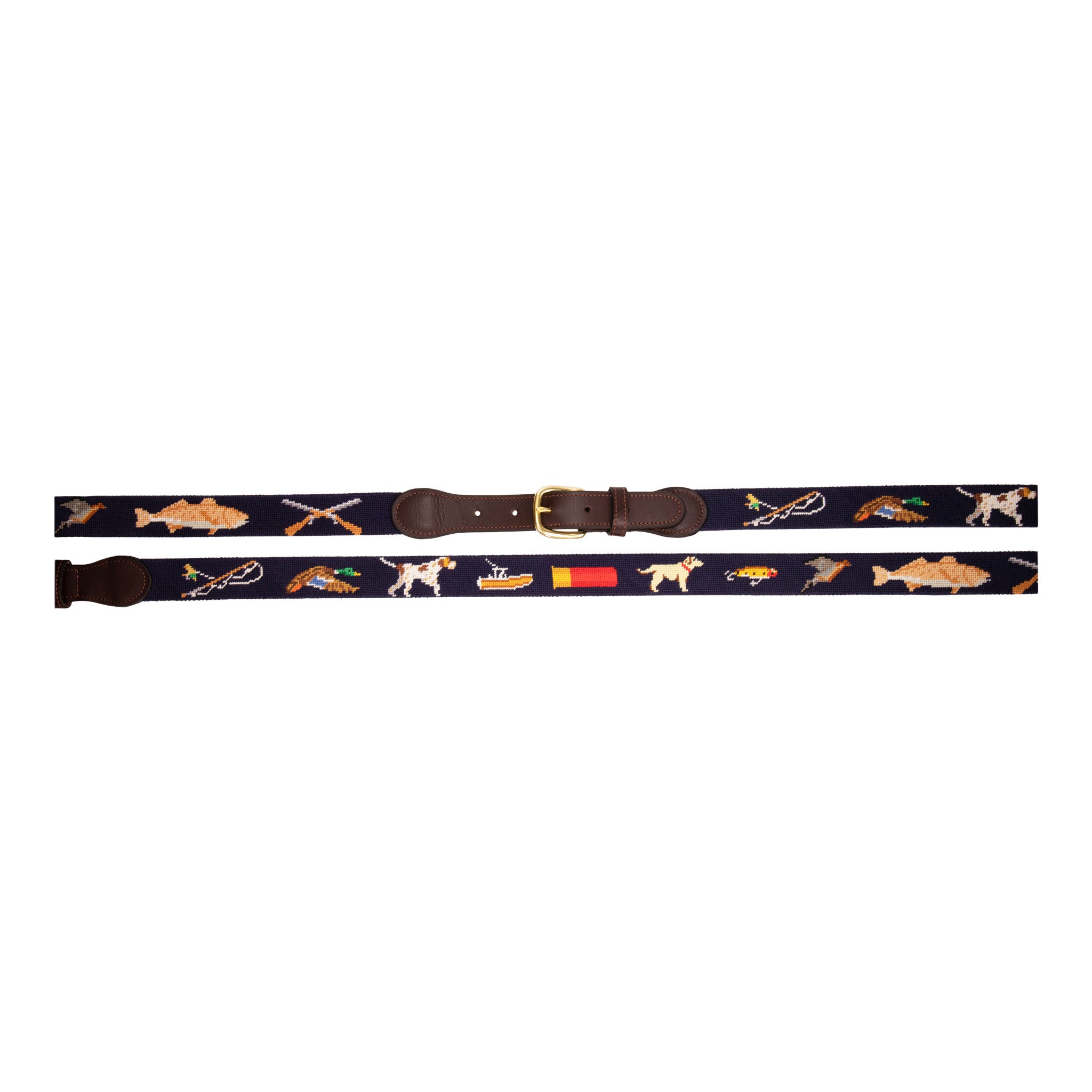 Sportsman Needlepoint Belt with navy blue background showing outdoor sporting themed images of a pointer dog, crossed shotguns, shotgun shell, fly fishing rod, redfish, fishing boat, flying duck and dove.  Belt has brass buckle and full-grain leather backing.
