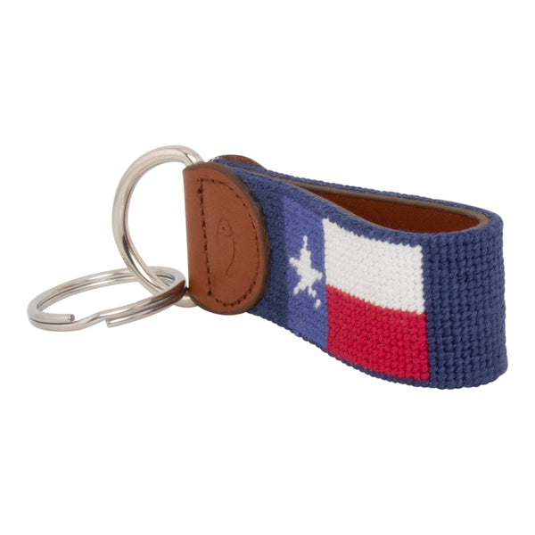 Hand-stitched Texas Flag needlepoint keychain showing a Texas Flag on both sides against a navy blue background and leather backing.  Stainless steel D-ring and keyring.