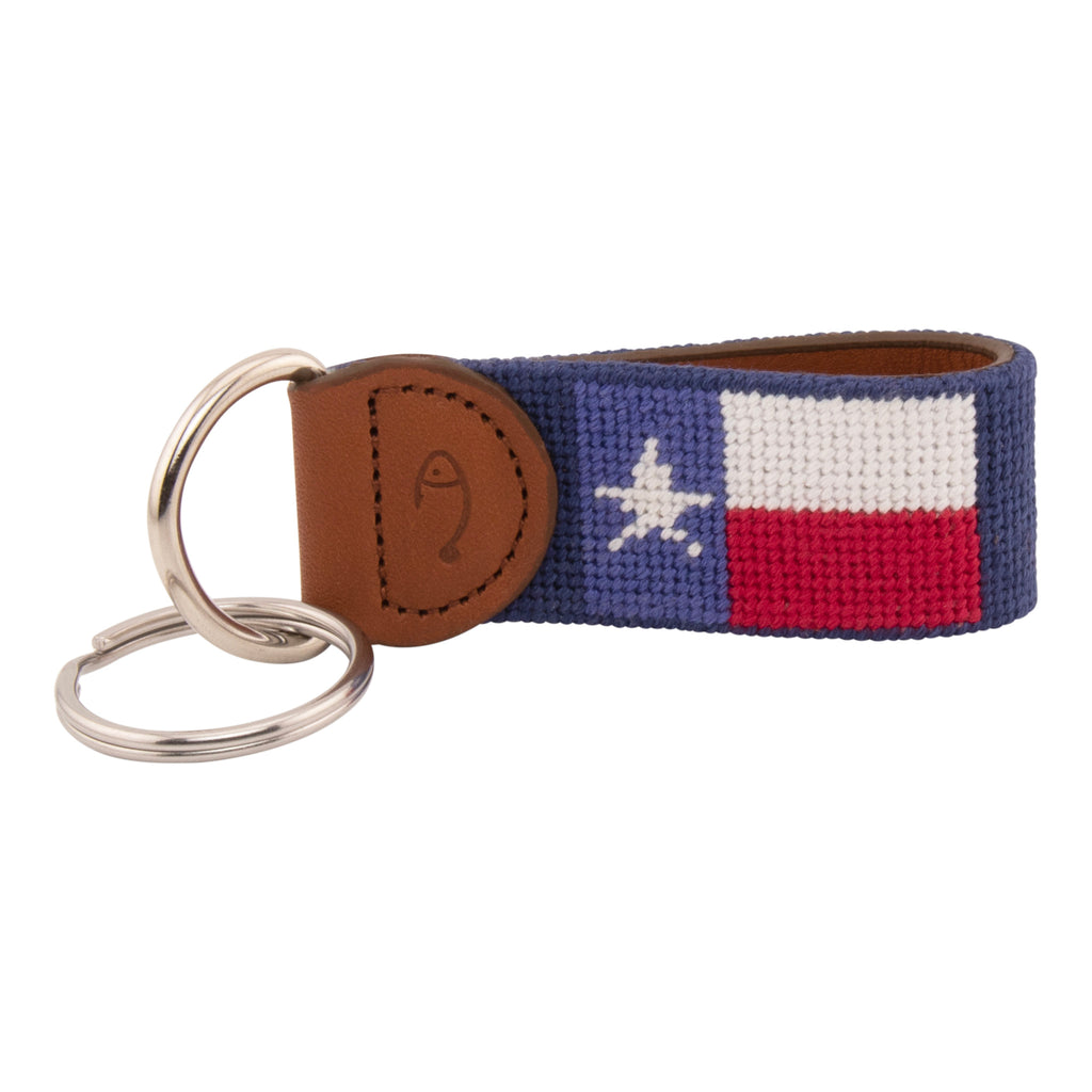 Hand-stitched Texas Flag needlepoint keychain showing a Texas Flag on both sides against a navy blue background and leather backing.  Stainless steel D-ring and keyring.