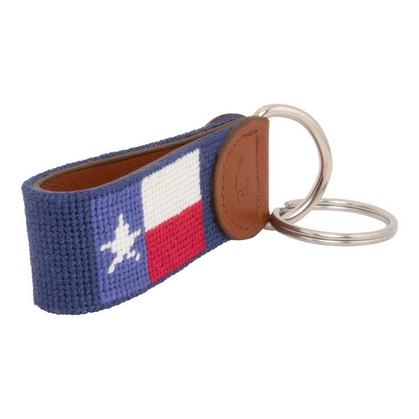 Hand-stitched Texas Flag needlepoint keychain showing a Texas Flag on both sides against a navy blue background and leather backing.  Stainless steel D-ring and keyring.