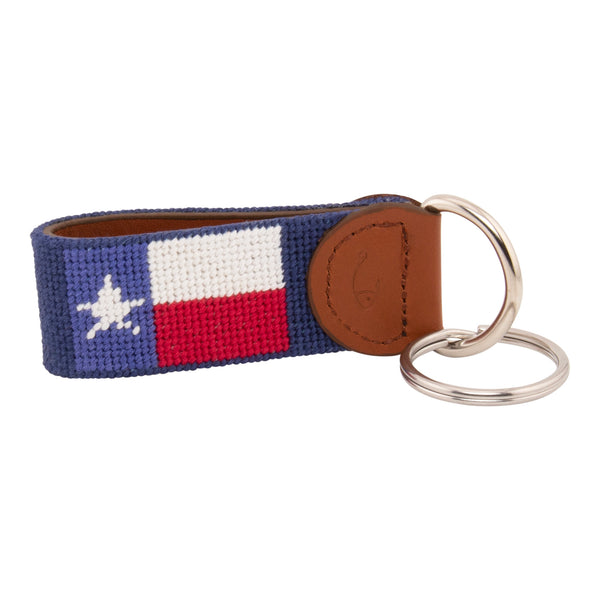 Hand-stitched Texas Flag needlepoint keychain showing a Texas Flag on both sides against a navy blue background and leather backing.  Stainless steel D-ring and keyring.