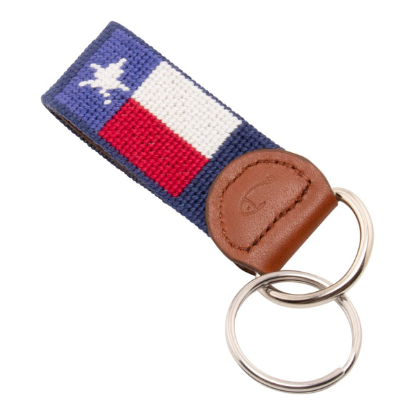 Hand-stitched Texas Flag needlepoint keychain showing a Texas Flag on both sides against a navy blue background and leather backing.  Stainless steel D-ring and keyring.