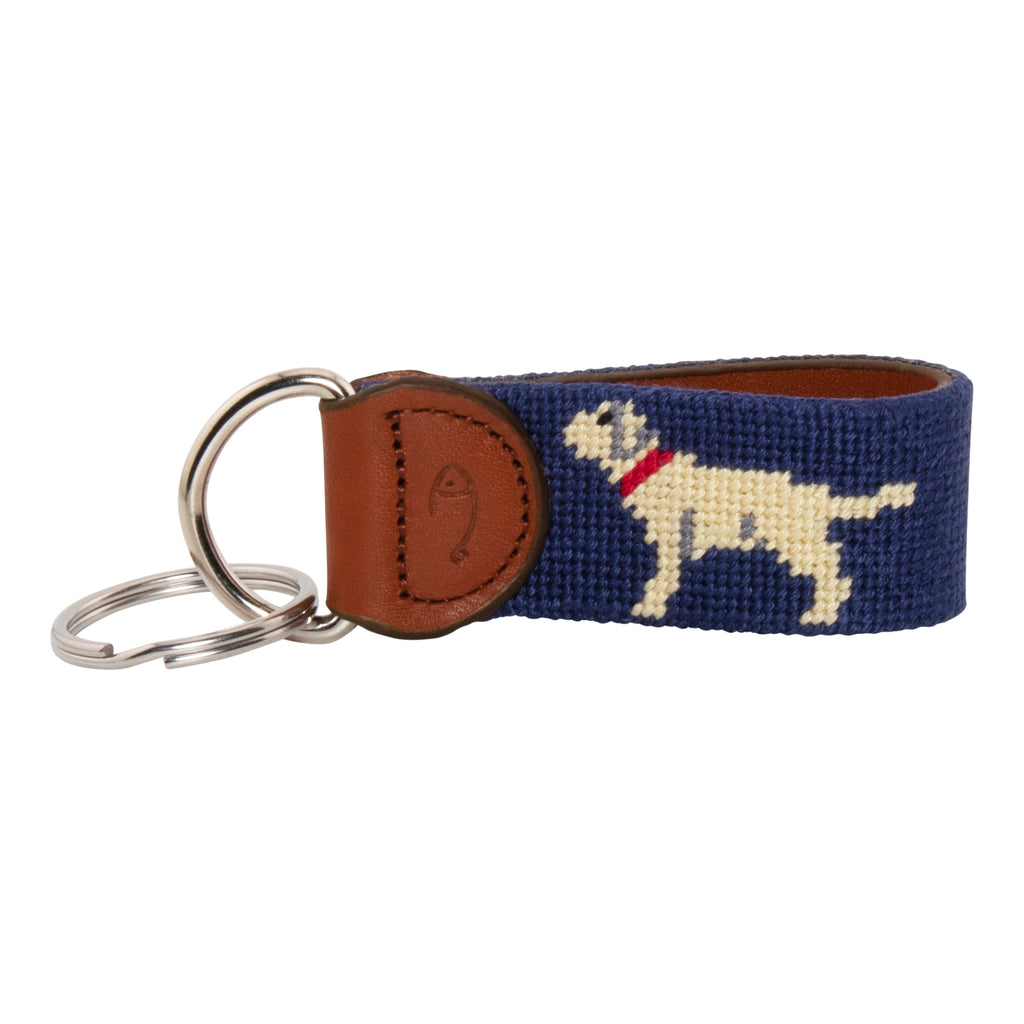 Hand-stitched yellow Labrador needlepoint keychain showing a yellow lab on both sides against a navy blue background and leather backing.  Stainless steel D-ring and keyring.